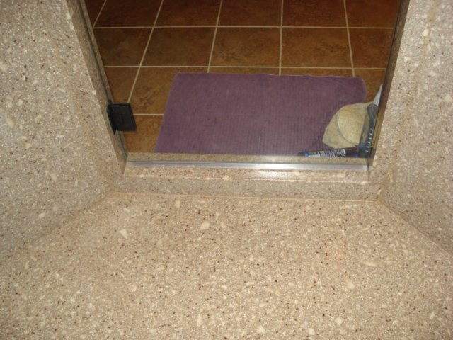 solidsurfaceshowercurb.jpg