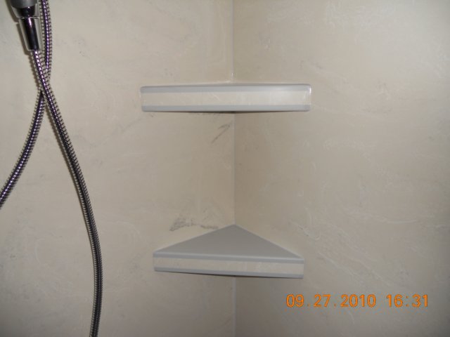 solidsurfaceshowershelves.jpg