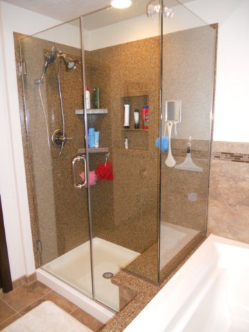 solidsurfaceshowerwithcustomglass.jpg