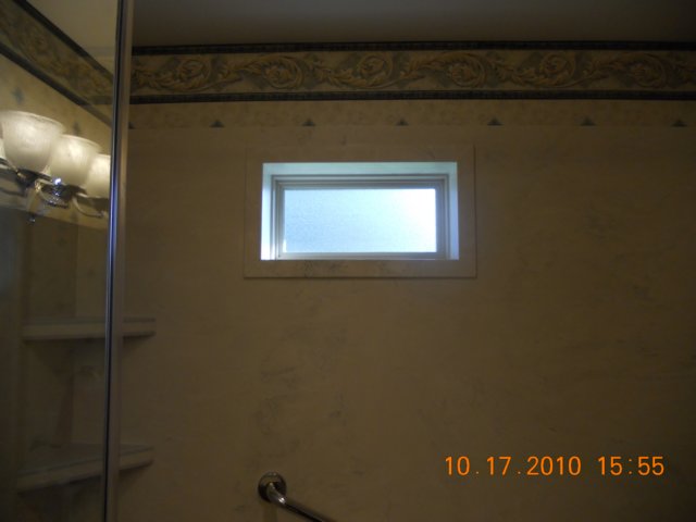 solidsurfaceshowertrimaroundwindow.jpg